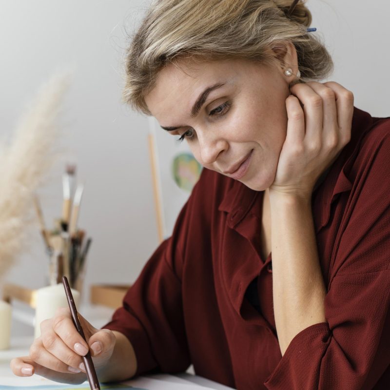 young-artist-painting-with-watercolors